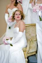 Formal white gloves featured at a debutante event.